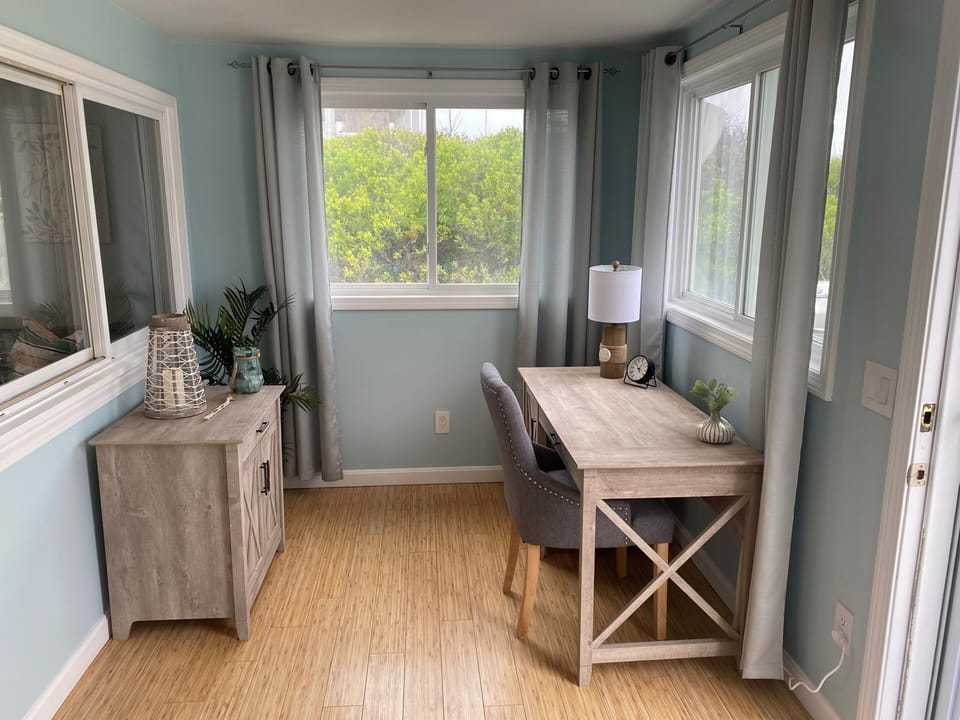 Office area in enclosed sunroom