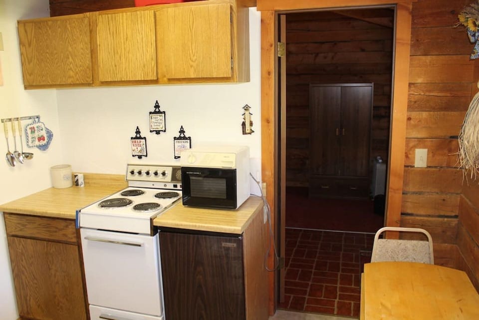 Apartment-sized stove and mini-fridge.