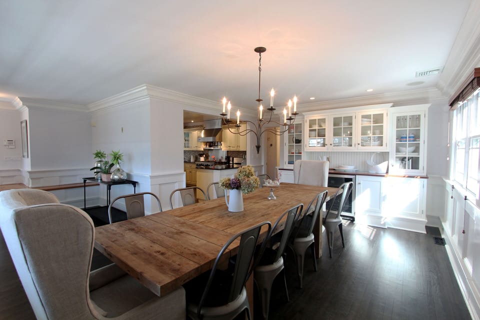 Large reclaimed wood dining room table, can accommodate up to 10 people