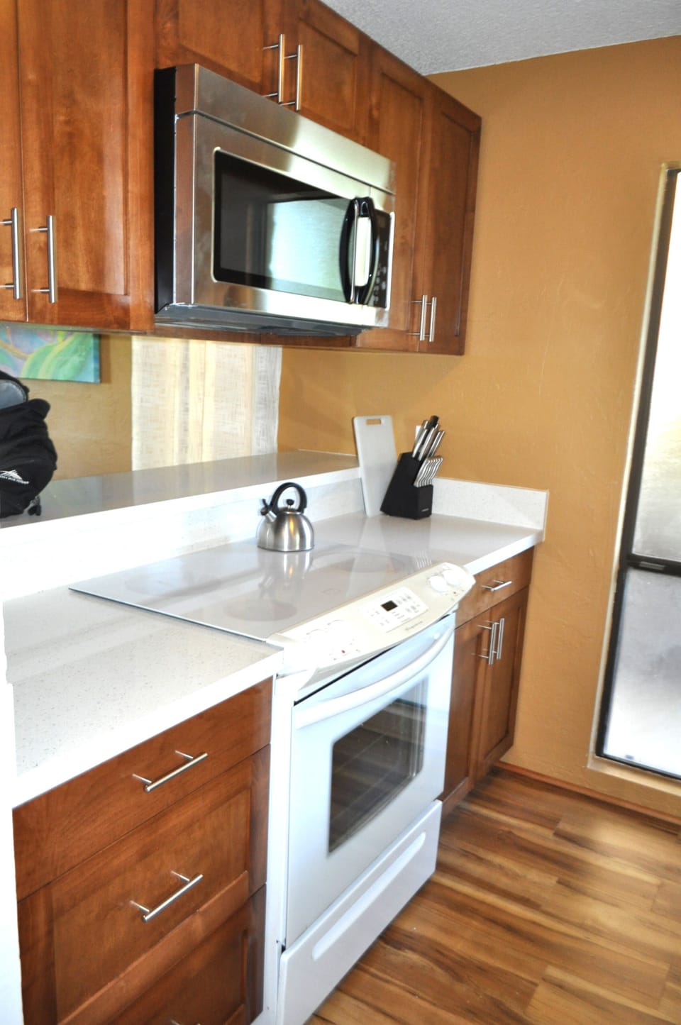 Remodeled kitchen with new cabinets, quartz counter tops, sink, faucet and micro