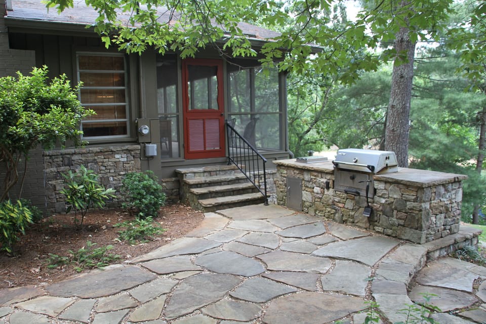 Outdoor kitchen and stone patio
