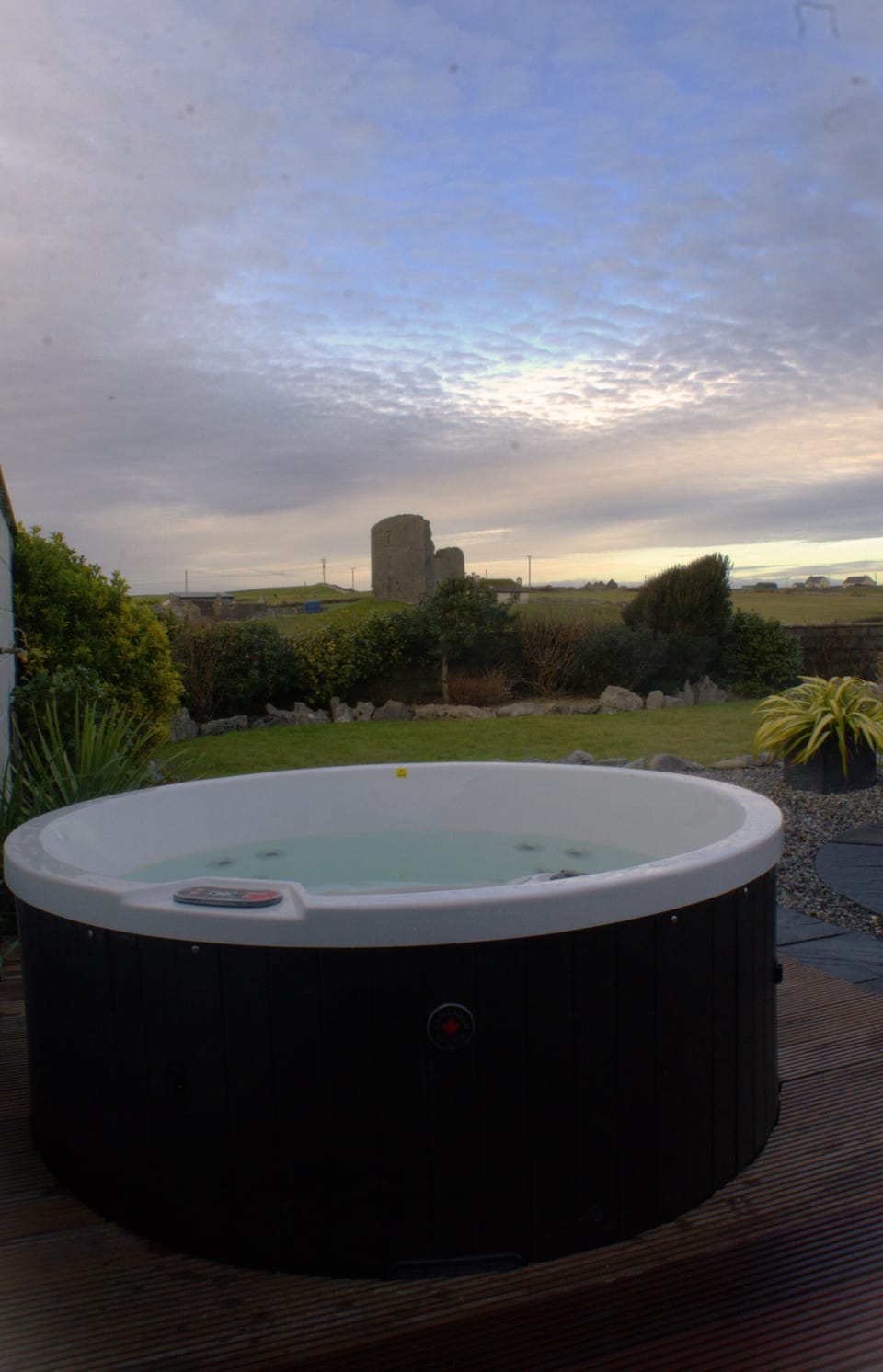 Private terrace with outdoor hot tub with view of 500 yr old castle