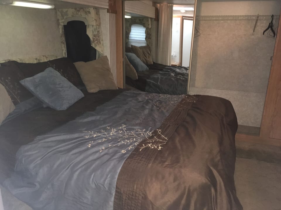 Queen bed in fifth wheel area and plenty of storage space.