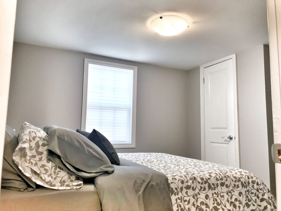 First bedroom with Q bed, plenty of closet space, hangers and drawer space.