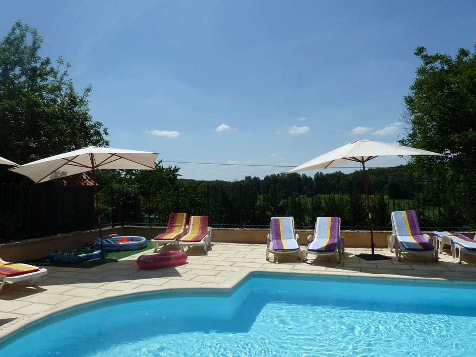 Securely fenced with paddling pool and water play table