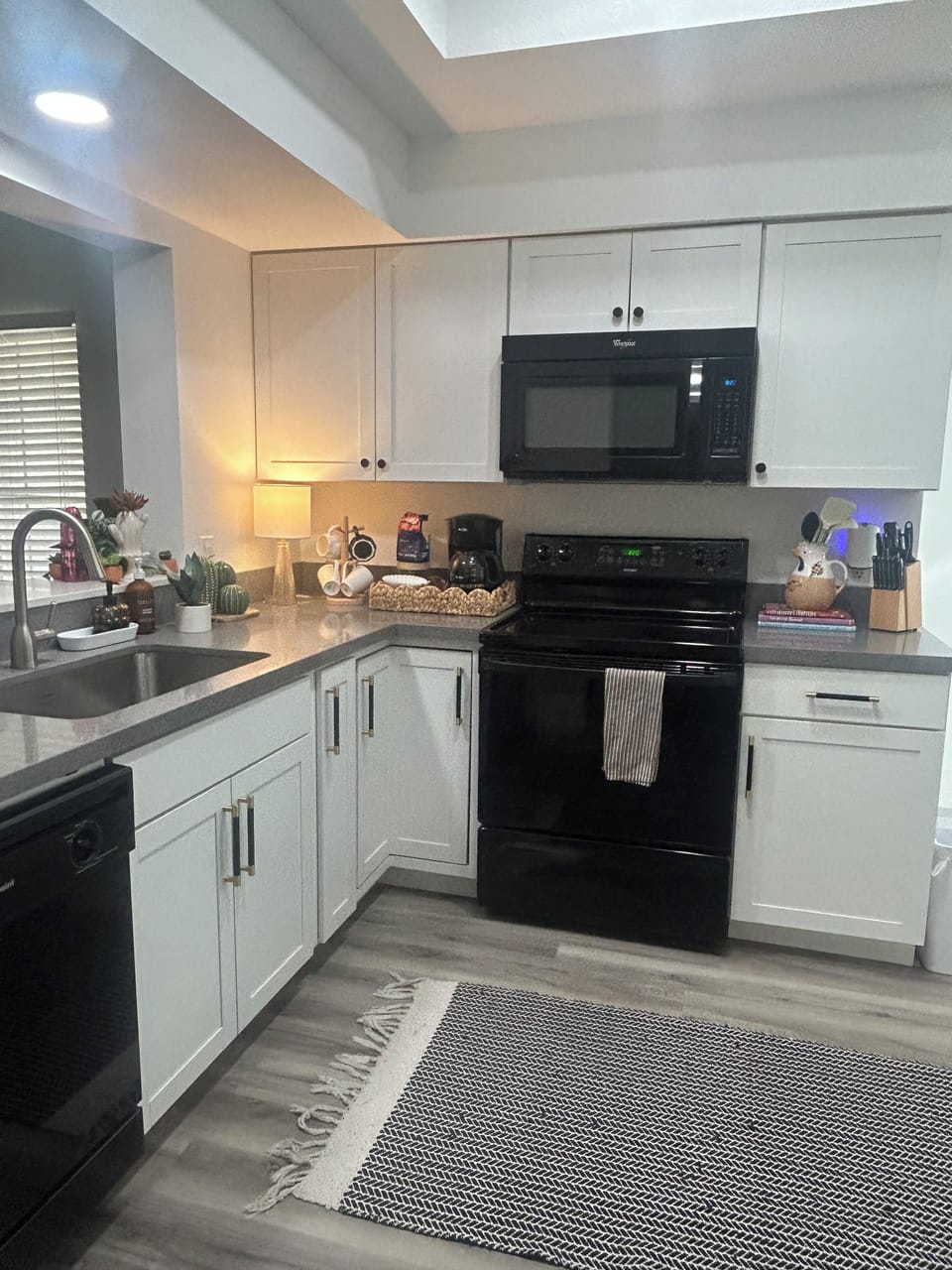 Kitchen with stove, oven, microwave, coffee maker. (Coffee & creamer provided)