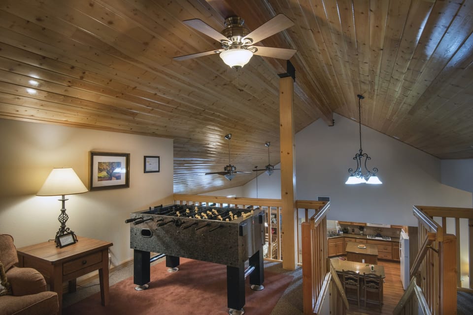 Loft area with a Foosball table