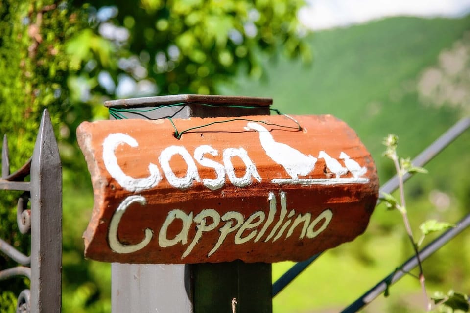 The sign on the gate.