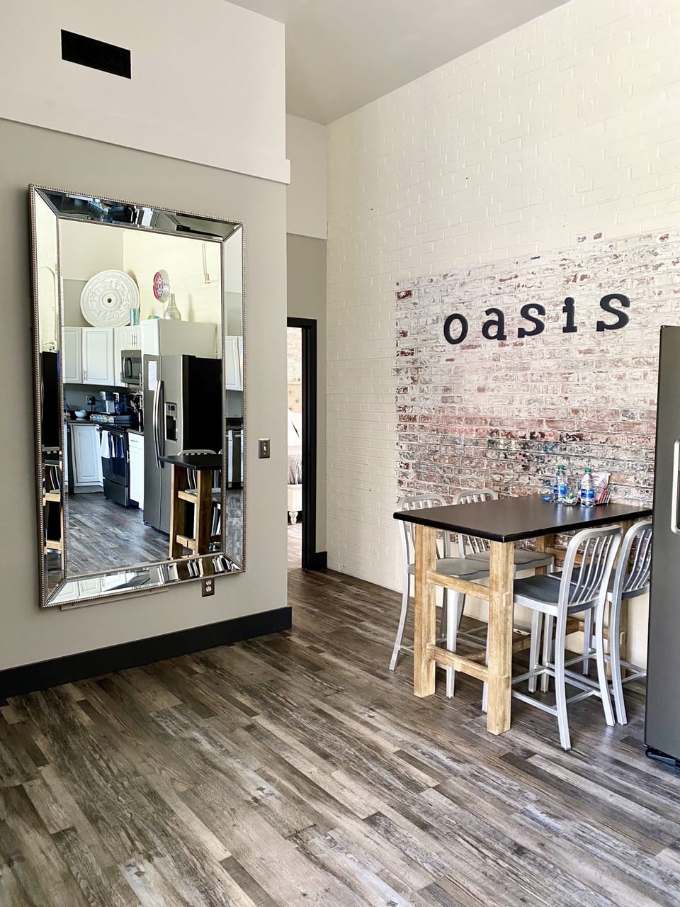 Dining area in the kitchen. Huge wall mirror for fun selfies or primping. 