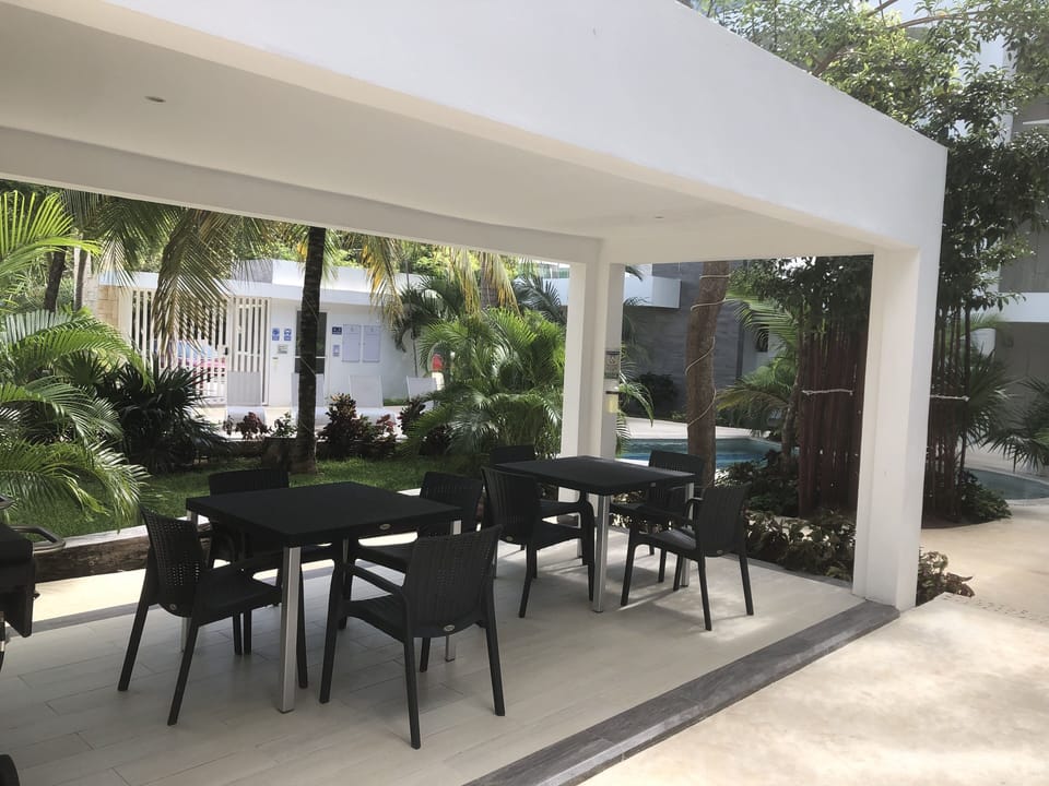 Common area seating and BBQ area.  Next to the pool.