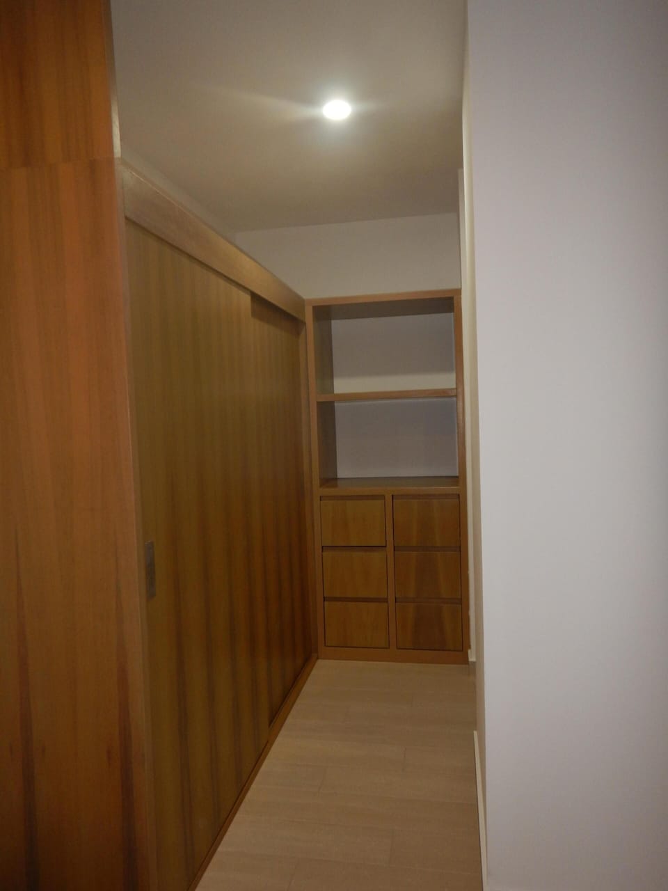 Master closet and hallway leads to master bathroom