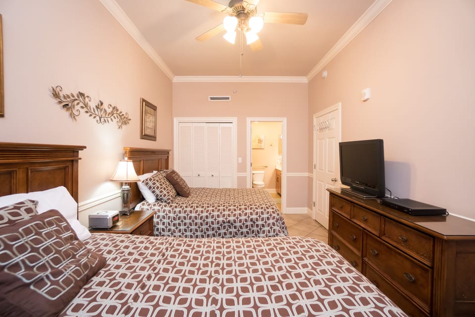 One queen bed, one full bed with dresser and flat screen TV.  Private bathroom.