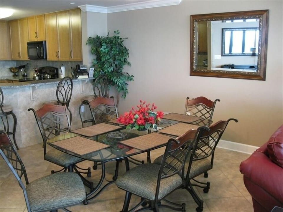 Dining table for 6 with 4 bar stools for extra seating for guest.