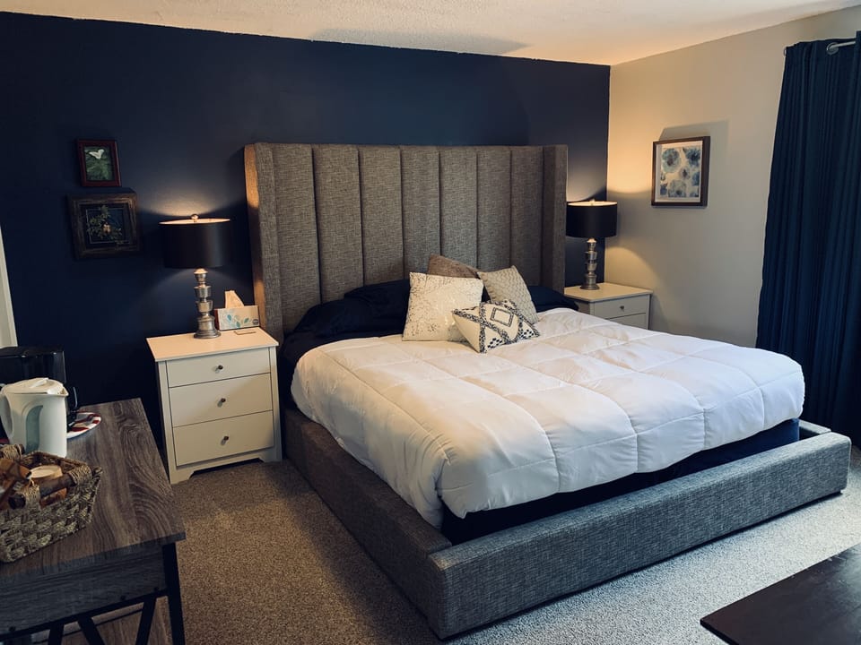 King size bed with personal bathroom, coffee bar, writing desk, refrigerator 