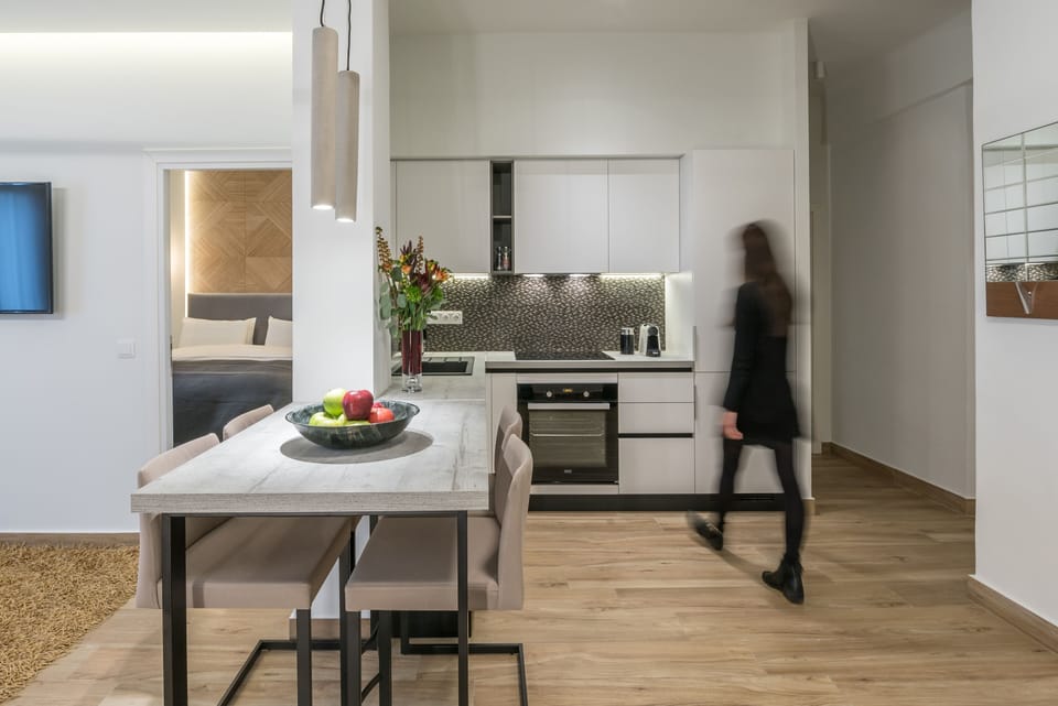 Cast concrete dining table and kitchen beyond