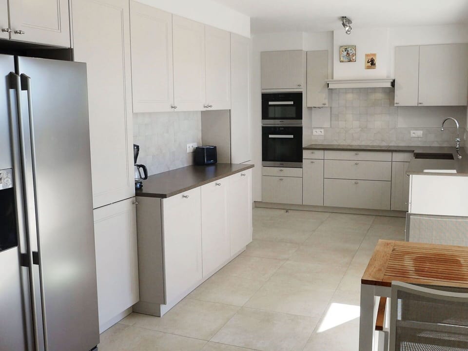 Room, Countertop, Kitchen, Property, Furniture, Cabinetry, Major Appliance, Floor, Refrigerator, Tile