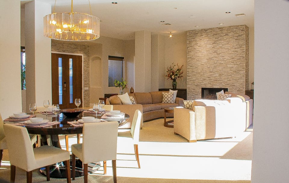 Carpeted living room and formal dining room with seating for 8
