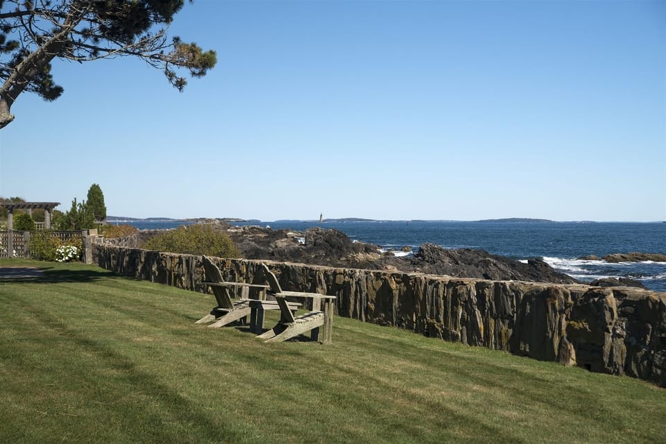 Front lawn with adirondack chairs and incredible ocean views.