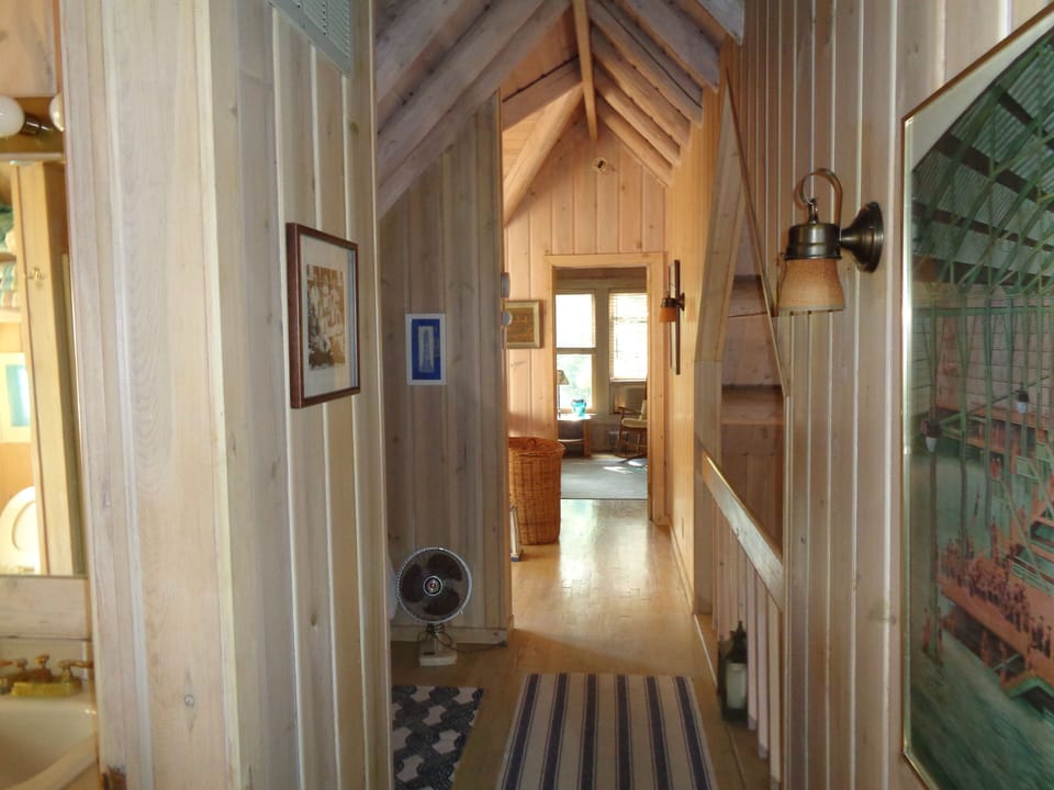 second floor hallway-a private bedroom at each end with center overlook 


