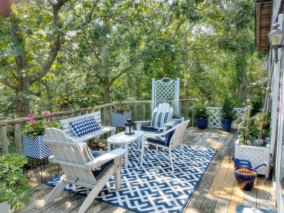 high elevated porch facing front lawn and street