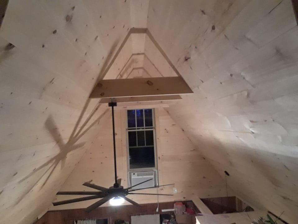 cathedral ceiling over main room. 72 in fan/ light, air with remote controls