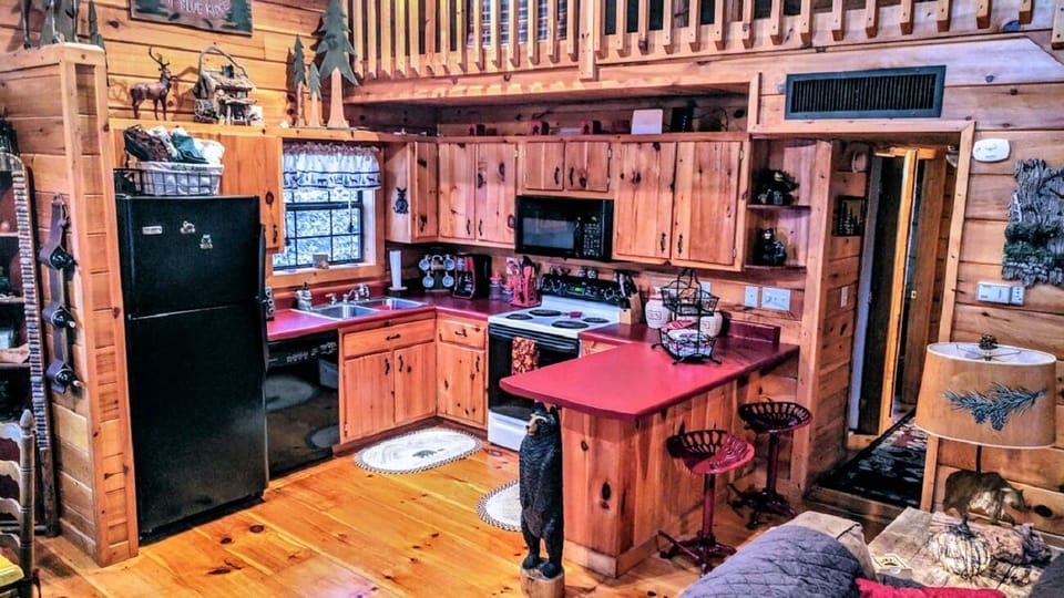 Well-stocked kitchen with breakfast bar