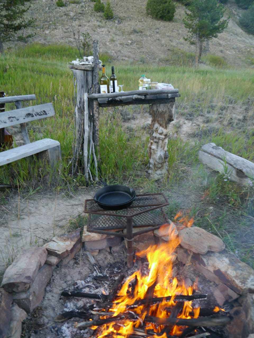 Fire pit with adjustable grill