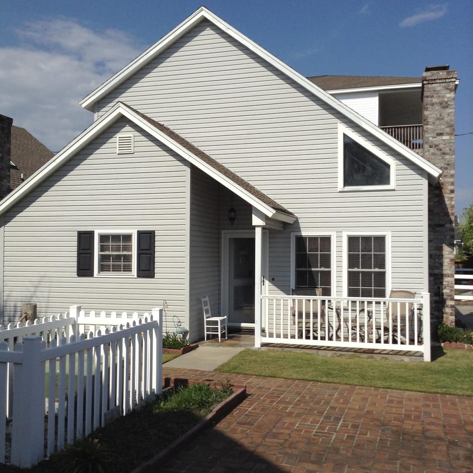 Front of house with bistro table and seats 