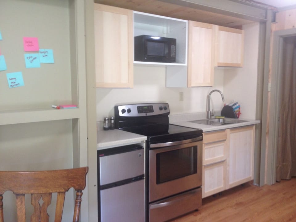 Kitchenette with full sized electric stove.