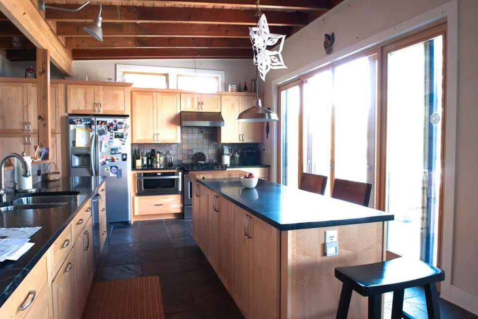 Custom kitchen. Soapstone countertops. Kitchen is equipped for amazing meals.