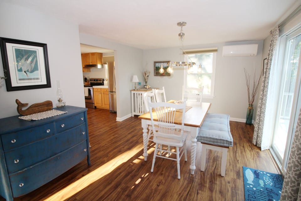 Dining room leads to kitchen and deck