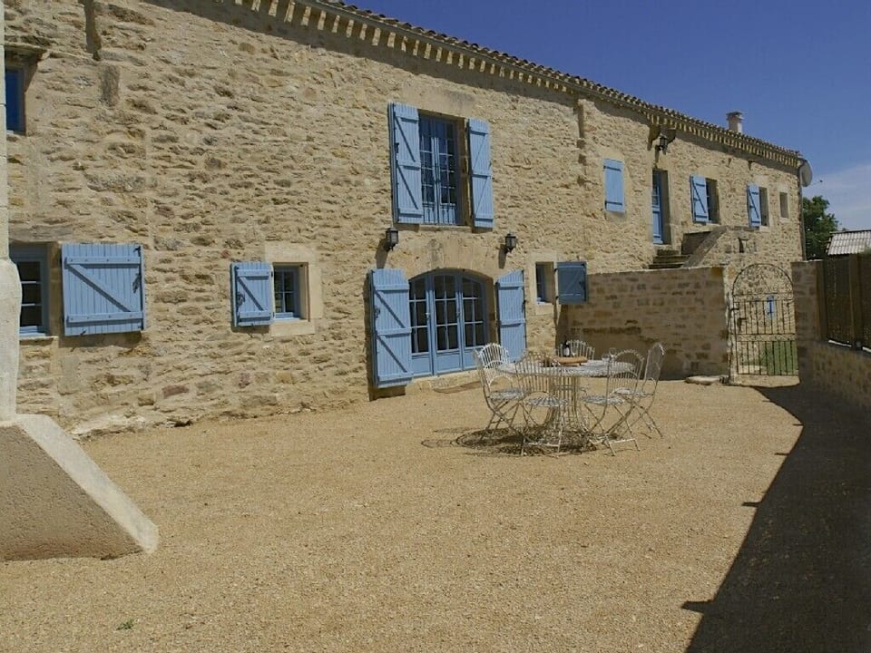 Enclosed courtyard with seating ideal for boules
