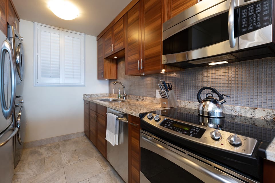 Large kitchen with GE Profile appliances.