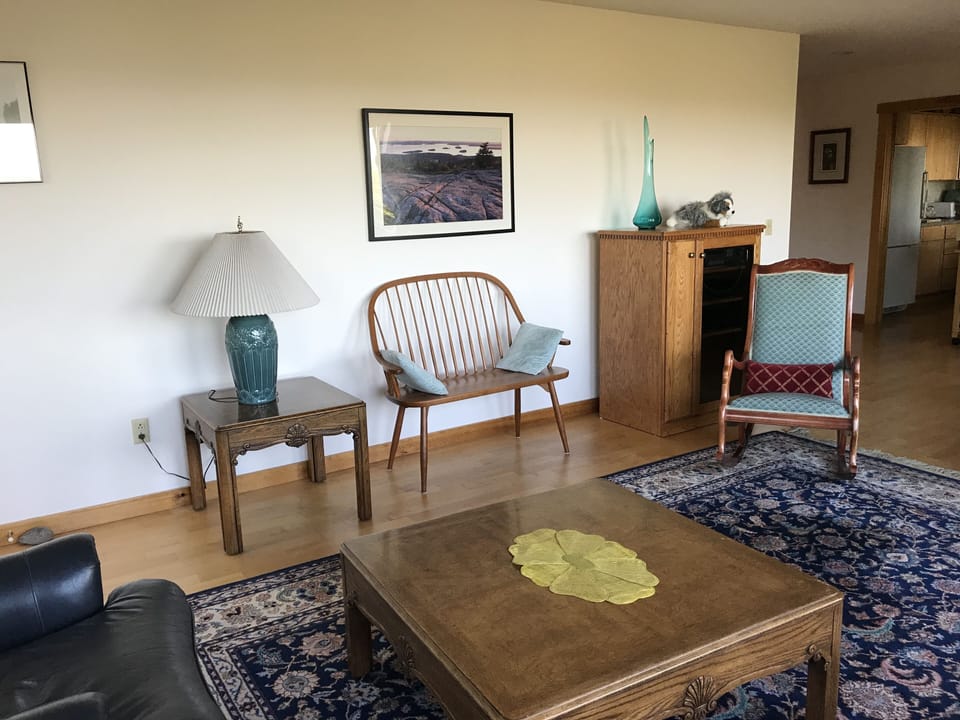 Custom-built wooden bench to watch the sunset from the living room.