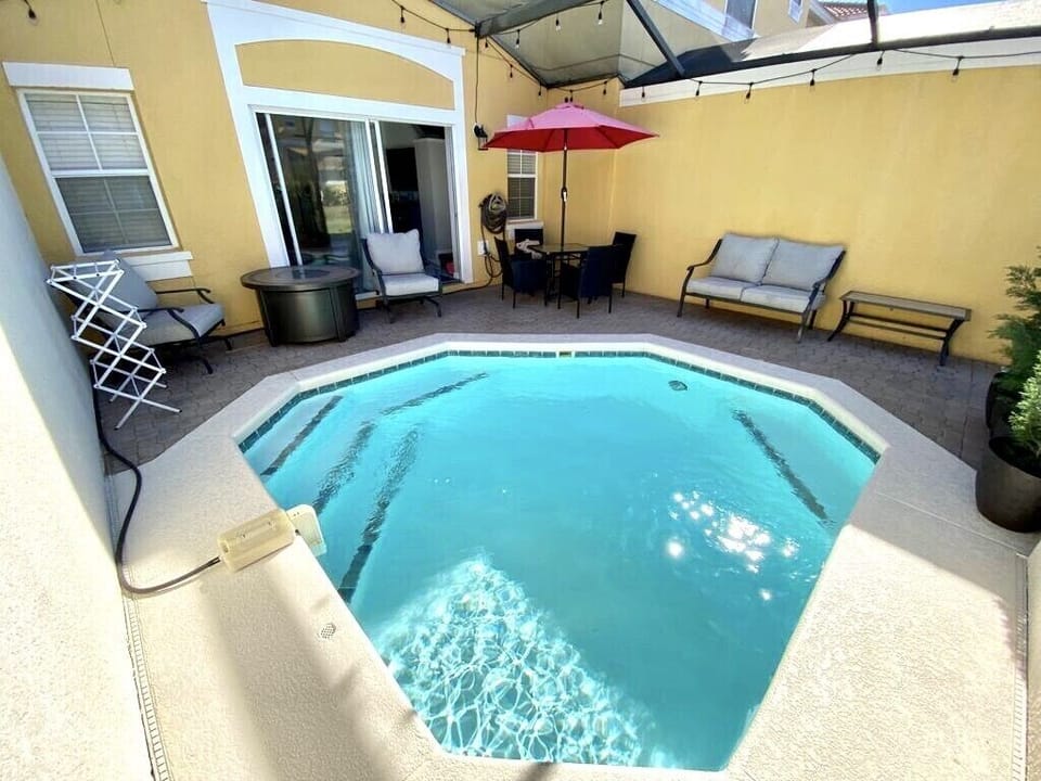 Patio with a heated pool