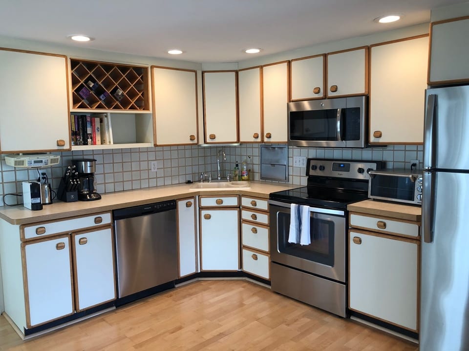 Kitchen with all new appliances and kitchen wares.  Well equipped for cooking.