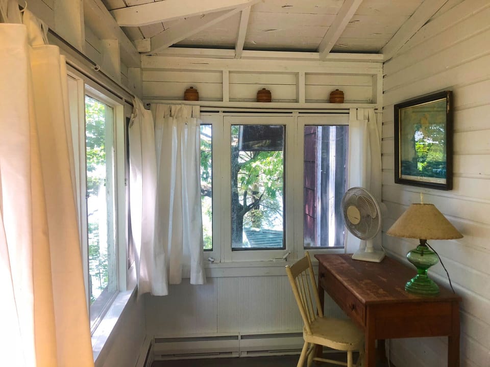 Queen room on backside of house. Faces backyard and window facing water.