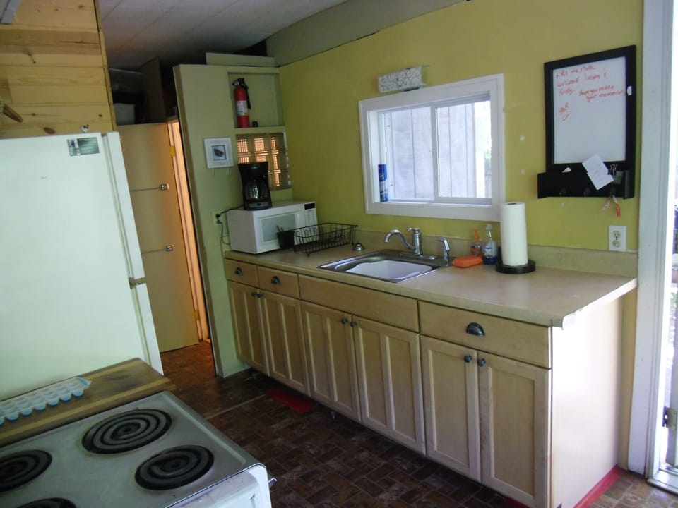 Kitchen stocks dishes , pots  pans, Mr Coffee, microwave, full size range &Refri