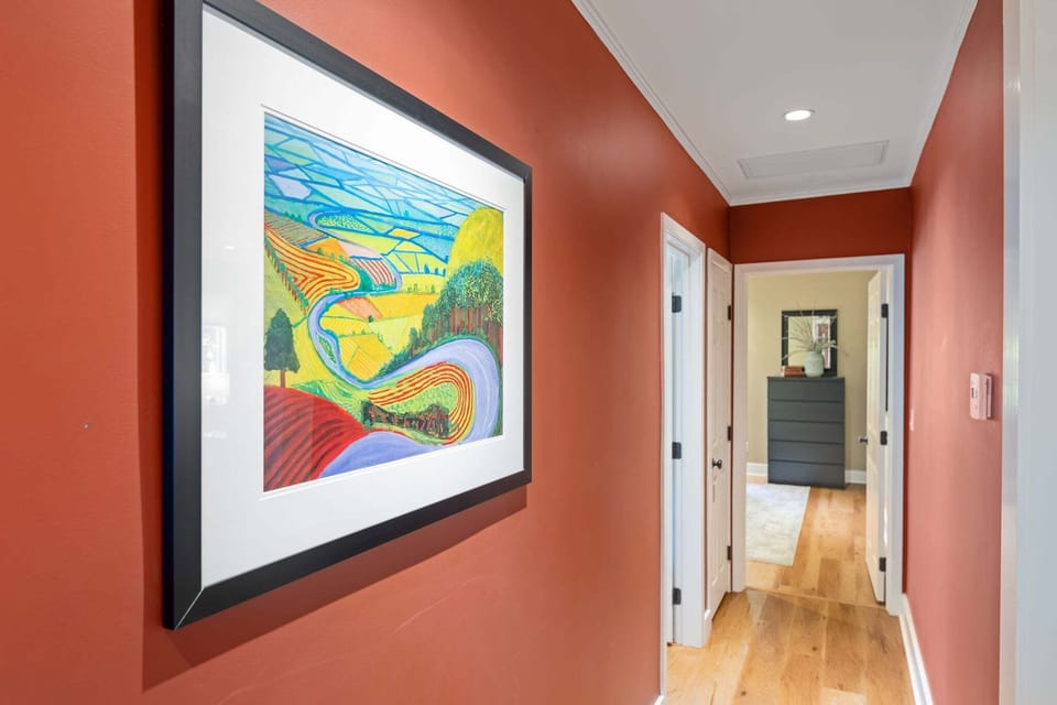 There is fine artwork throughout the home adding the colorful and tasteful eclectic style of this downtown home