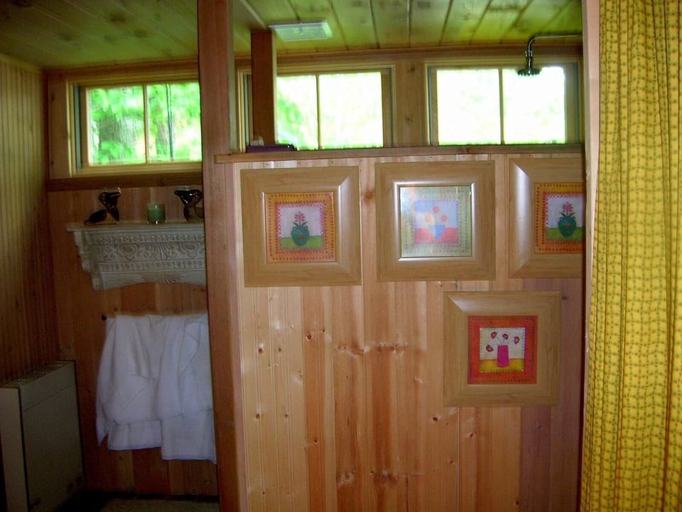 Windows give bathroom "open air" feel. 