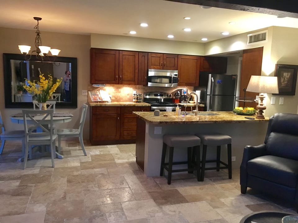 kitchen with laundry room off of carport entrance