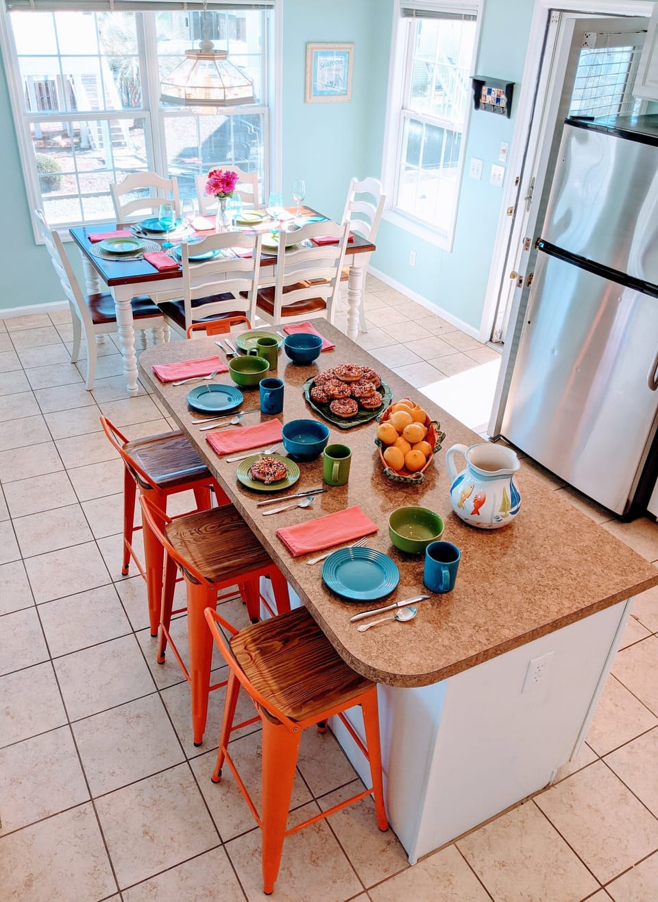 Bright and open kitchen layout w/ seating for 6 at table and 4 at bar/island!