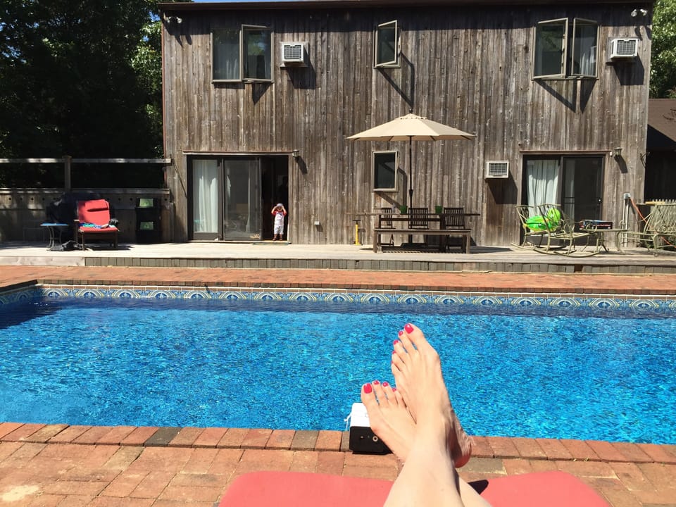 Lying out on the second deck with view of back of house