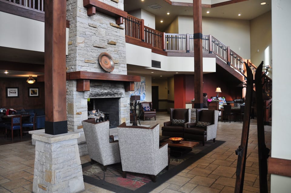 Common area with large fireplace and fully stocked coffee/hot chocolate bar.