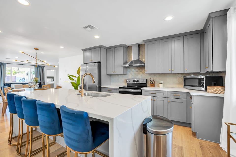 Chef's kitchen with large island & bar seating