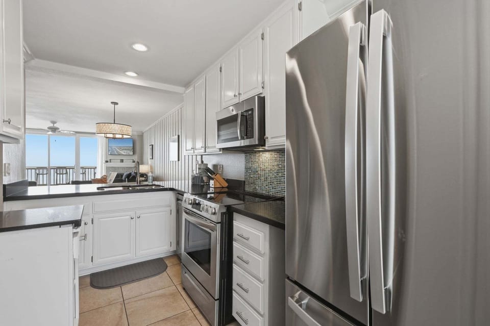Clean, open flow from the kitchen to the dining and living spaces
