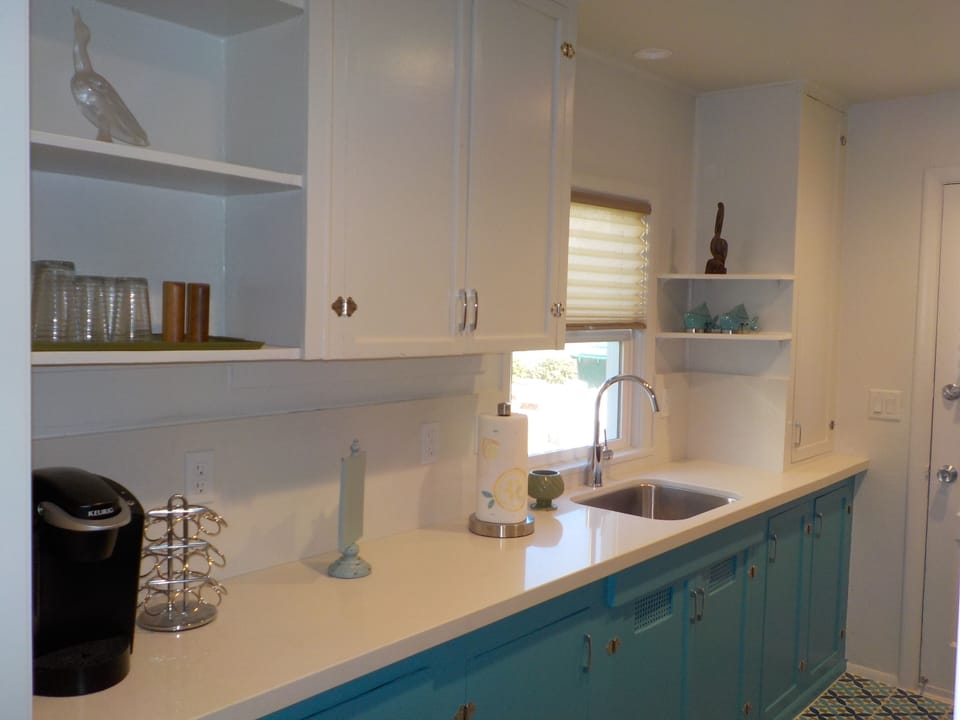 Original cabinets add appeal to the kitchen.  