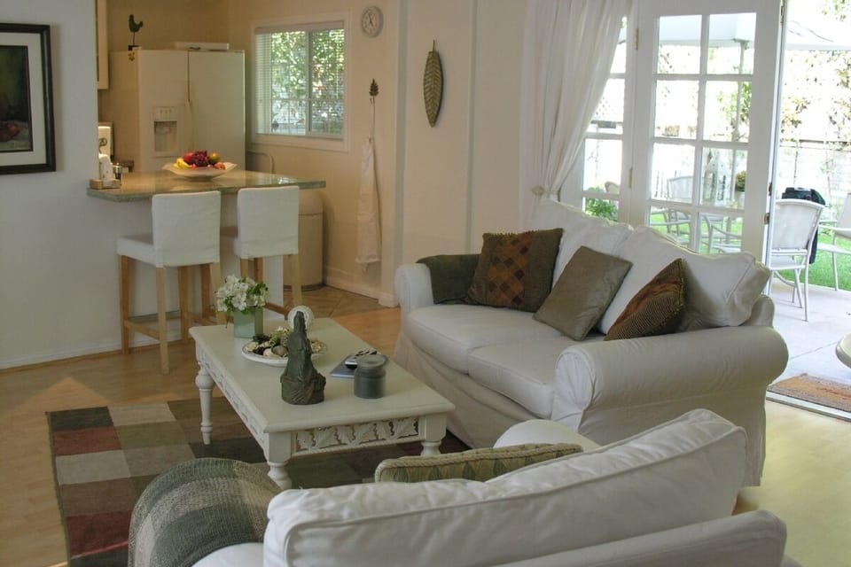 Living room view to kitchen and yard