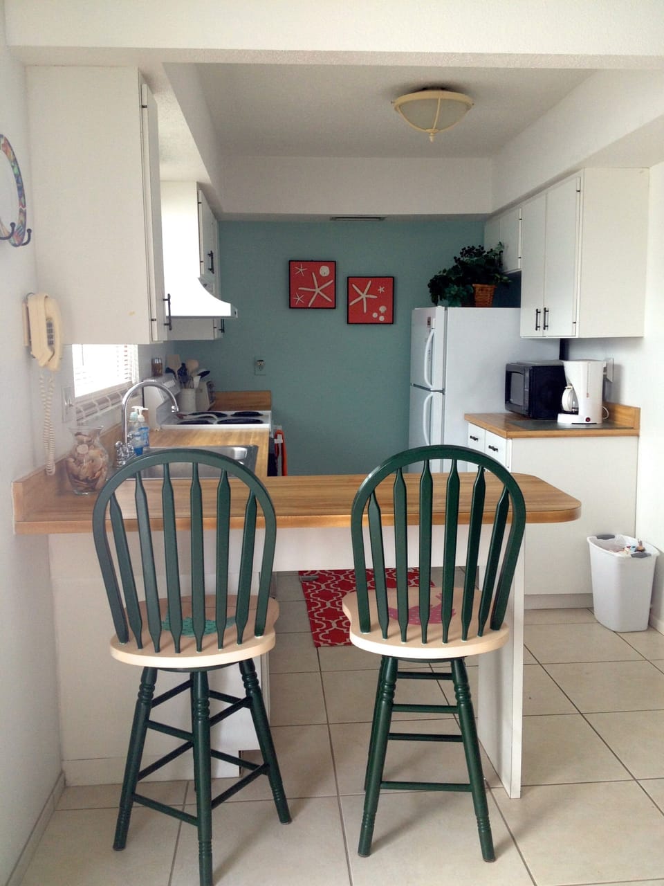 Kitchen with breakfast bar and separate laundry room