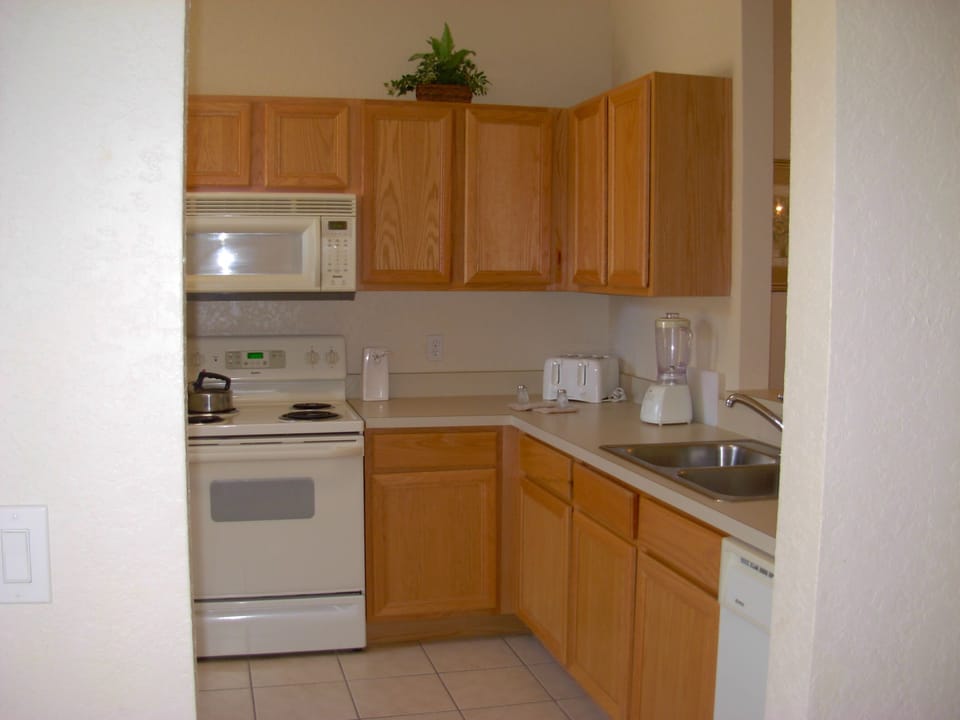 Kitchen w small eating table at window